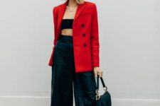02 a black bandeau top, black leather culottes, black heels, a saddle bag and a bold red blazer