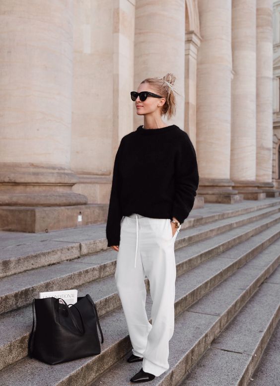 an everyday look with a black jumper, white pants, black shoes and a black tote - you won't need more for a comfy feel