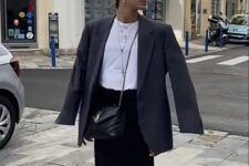 05 a comfy modern outfit with a black maxi slip skirt, a white t-shirt, an oversized grey blazer, navy Gazelle sneakers, a black bag and a cap