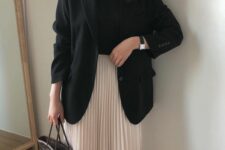 07 a black t-shirt, a black blazer, a blush pleated midi, a straw tote and a watch are an elegant work look for spring
