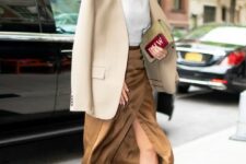07 a refined and feminine office look with a white turtleneck, a brown wrap midi skirt, gold shoes, a beige blazer and a green clutch