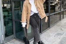 07 a white long sleeve top, black skinnies, a tan denim jacket, black chunky boots and a black bag with chain
