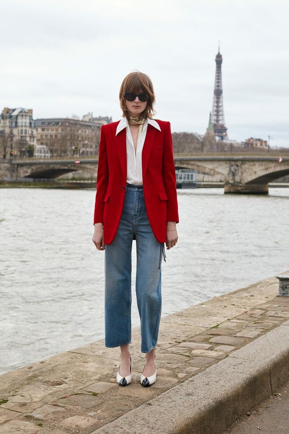 a Parisian look with a white button down, blue jeans, a red blazer and two-tone shoes is a cool idea