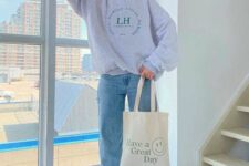 10 a simple sport chic look for every day with straight leg blue jeans, a grey sweatshirt, white sneakers and a neutral canvas bag