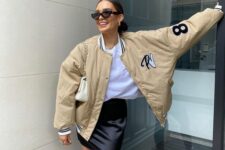10 a white t-shirt, a black mini skirt, a beige bomber jacket and a creamy bag are a lovely look for spring