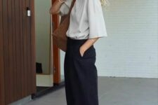 13 a minimalist outfit with a dove grey t-shirt, black trousers, green Gazelle sneakers, a brown tote for spring