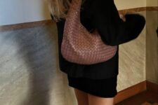 13 a total black look with a black mini skirt, a cardigan, knee boots and a brown boho bag