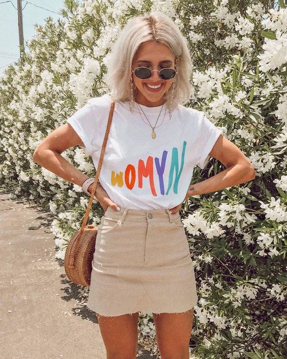 a bright printed t-shirt, a tan denim mini skirt, a wooden round crossbody bag for summer