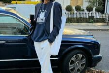 15 a navy sweatshirt, a black oversized blazer, white sweatpants, navy Adidas sneakers and a neutral canvas bag for spring
