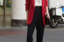 16 black trousers, a white button down, white sneakers, a red oversized blazer and a black bag for a casual work look
