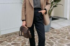 17 a Breton stripe top, black pants and black high tops, a beige oversied blazer and a brown printed bag for work