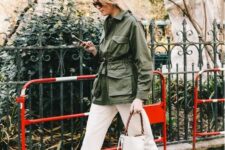 17 a green army jacket, white jeans, black boots, a black bucket bag for a stylish spring look