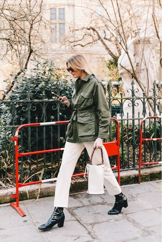 a green army jacket, white jeans, black boots, a black bucket bag for a stylish spring look