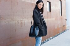 17 a simple everyday look with an oversized black blazer, ligth blue ripped jeans, black Gazelle sneakers, a black lacquer bag