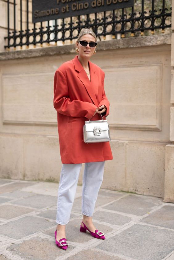 bleached jeans, fuchsia embellished shoes, an oversized red blazer and a silver bag for a refined spring look