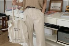 19 a comfy spring look with a white tee, a beige knit waistcoat, neutral trousers, tan sneakers and a neutral canvas bag