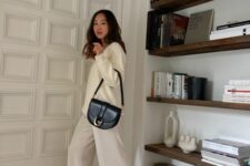 19 a neutral jumper and trousers, a black crossbody bag are a great solution for spring
