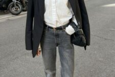 20 a chic outfit with a white button down, grey flare jeans, a black oversized blazer, black heels and a black hobo bag