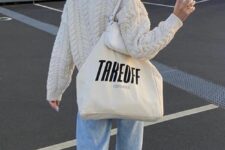 20 a creamy chunky knit cardigan, bleached blue jeans, purple sneakers, a white mini bag and a neutral canvas bag