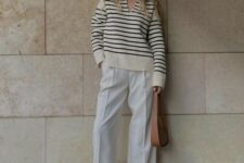 22 a Breton stripe polo shirt, white palazzo pants, white sneakers and a brown bag are amazing for spring