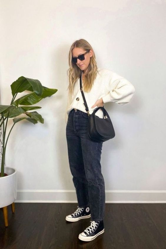 a white cardigan tucked into grey jeans, black high top sneakers and a black bag will give you a nice monochromatic look for spring