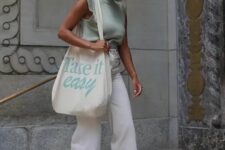 23 a light green jersey sleeveless top, neutral flare jeans, white sneakers, a neutral canvas bag are a cool idea for spring