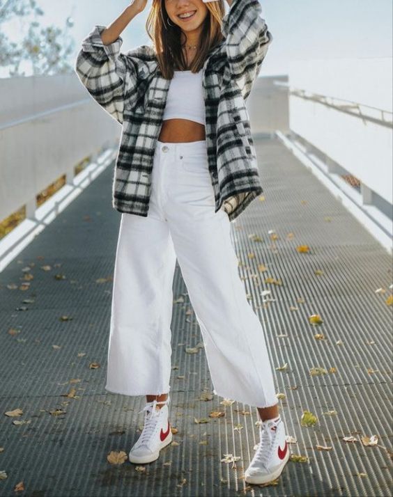 a white crop top, white cropped wideleg jeans, white high tops, a flannel shirt for a warm spring day