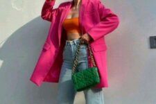 25 a colorful outfit with an orange crop top, bleached jeans, yellow shoes, an oversized pink blazer and a green bag with chain