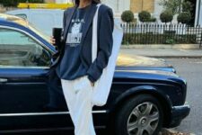25 a navy sweatshirt, a black oversized blazer, white sweatpants, navy Adidas sneakers and a neutral canvas bag for spring