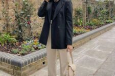 26 a work outfit with a black t-shirt, an oversized black blazer, tan trousers, a tan bag, white sneakers is amazing for spring