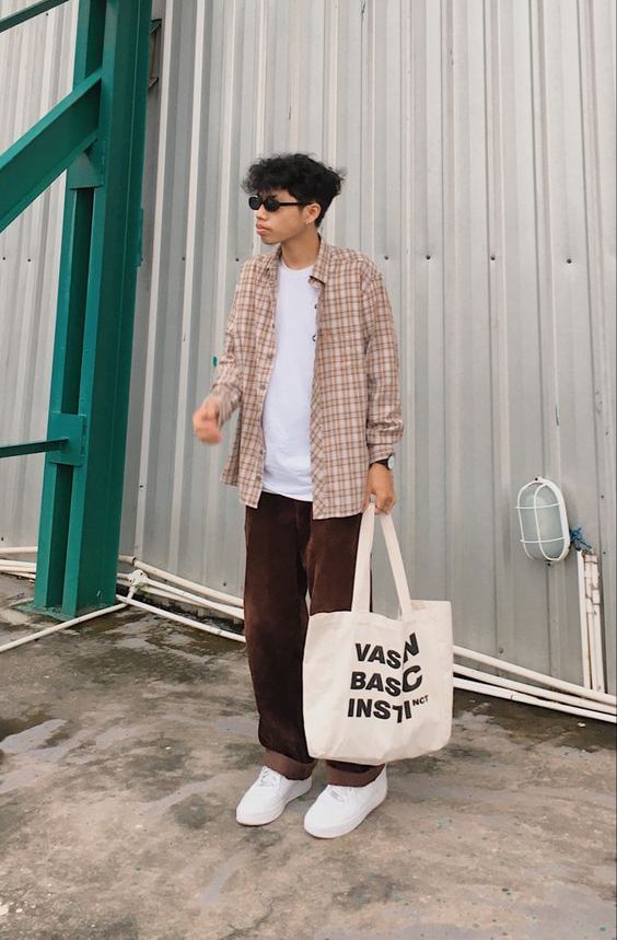 a white t shirt, a plaid shirt on top, brown velvet pants,white sneakers, a neutral canvas bag for spring