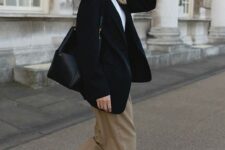 28 a smart casual look with a white shirt, taupe pants, white sneakers, an oversized black blazer and a bag, chic watch