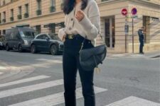 30 black cropped jeans, black high tops, a neutral cardigan tucked into jeans, a black saddle bag for a comfy every day look