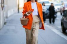 31 a bold spring work look with a white t-shirt, tan trousers, an oversized orange blazer, strappy shoes and a beige mini bag