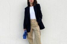 31 beige cargo pants, a white t-shirt, an oversized black blazer, electric blue Gazelle sneakers and a matching bag