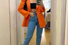 32 a chic night out look with a black bandeau top, blue mom jeans, black shoes, an orange blazer and a black bag
