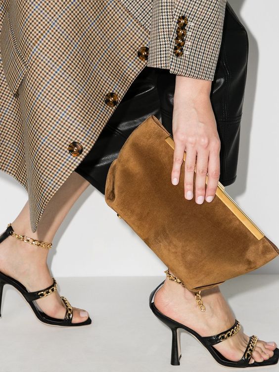 a rust-colored fabric clutch with gold detailing is a fresh and bold modern idea of a clutch for special occasions