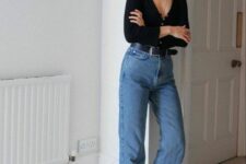 32 blue high waisted jeans, black high top sneakers, a black button up top with long sleeves and a black belt for spring