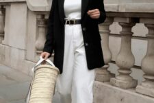 34 a white top, baggy jeans, a black blazer, black sandals and a straw bag for a relaxed spring look