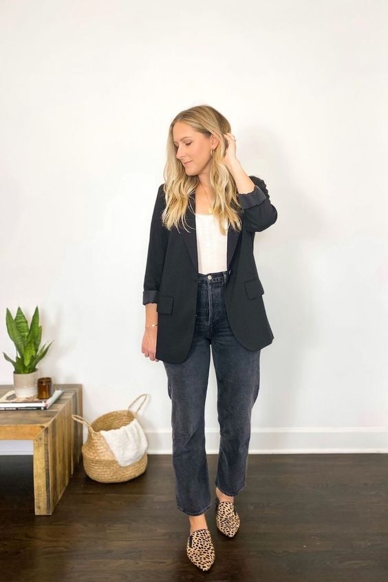 a white top, grey jeans, leopard print loafers, a black blazer are a simple and cool look for spring