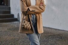 36 a lovely casual outfit with a white turtleneck, blue cropped jeans, snakeskin print loafers and a beige oversized blazer plus a printed bag