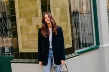 37 a white t-shirt, blue cropped jeans, black ankle strap shoes, an oversized blazer and a small black bag with a ring handle