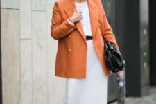 37 whimsy black shoes, a white tee, a white midi skirt, an orange oversized blazer and a large black clutch