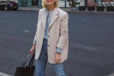 40 a striped shirt, a tan oversized blazer, blue jeans, navy sneakers and a black tote for a casual work look