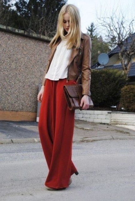 With beige button down shirt, brown leather clutch and beige high heels