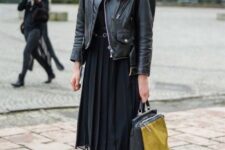 With black blouse, black and yellow tote bag, tights and black patent leather boots