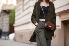 With black fitted crop top, necklace, brown leather crossbody bag and white sneakers