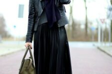 With black wide brim hat, gray sweater, dark blue scarf, olive green leather tote bag, black tights and black patent leather low heeled ankle boots