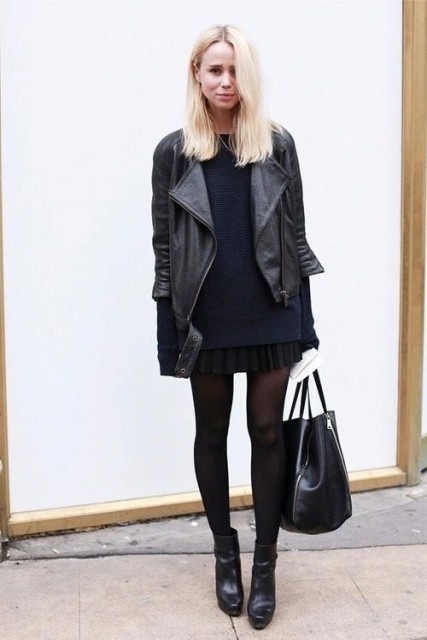 With dark blue long sweater, black leather tote bag, black tights and black leather ankle boots