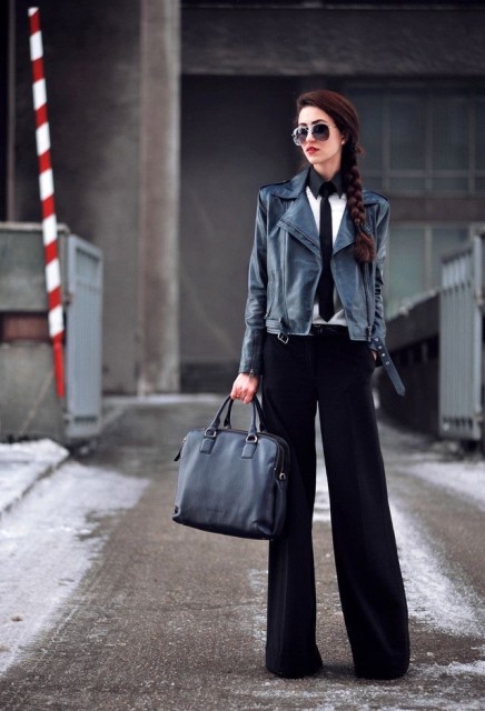 With oversized sunglasses, black and white shirt, black tie, black leather tote bag and shoes